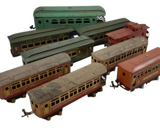 528 - Lot O Scale Trains (Description): A lot of O scale trains. The collection includes multiple passenger cars and freight cars in various colors and conditions.