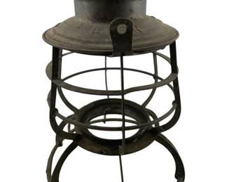 795 - LVRR Railroad Lantern, no glass 10"x7" (Description): Lehigh Valley Railroad lantern in black metal construction. Features a perforated ventilated top, wire cage globe guard, and bail handle. Measures 10 inches tall by 7 inches wide.