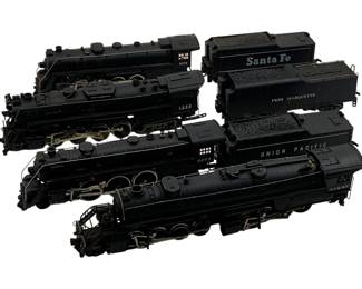 990 - 4pc Lot HO-Scale Locomotives & Coal Cars (Description): A four-piece lot of HO-scale model train locomotives and coal cars. The collection includes engines and tenders representing various railroad lines. Each piece measures approximately 2 1/2 inches by 10 inches by 1.5 inches.