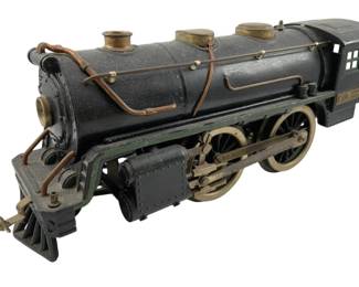 750 - Lionel Lines No384 Locomotive 5"x13"x4" (Description): Lionel Lines No384 locomotive. This vintage model train engine features classic styling typical of the Lionel brand. Measures 5 inches high by 13 inches long by 4 inches wide.