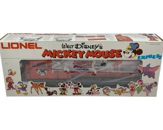 1034 - Lionel Mickey Mouse Locomotive O Scale (Description): Lionel Mickey Mouse Locomotive in O Scale, presented in its original box. This Walt Disney's Mickey Mouse Express locomotive features the classic Disney character theming associated with Lionel's licensed train products.