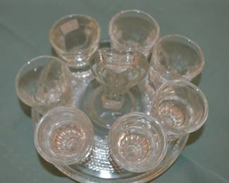 Vintage shot glass set with glass caddy