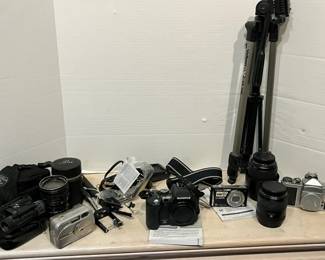 Three Digital Cameras A 35mm Film Camera And More