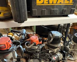 Assorted Power Tools including Ridgid Table Saw, Delta Bench Grinder, and Porter-Cable/Craftsman Routers