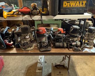 Assorted Power Tools including Ridgid Table Saw, Delta Bench Grinder, and Porter-Cable/Craftsman Routers