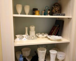 Shelf of milk glass vases and decor