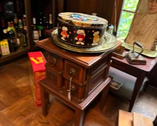 Antique sewing machine cabinet and decorative tin
