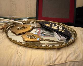 Vintage gilt vanity mirror and brush set on tray