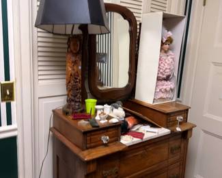 Antique dresser with mirror and table lamp