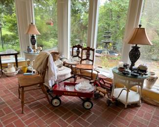 Sunroom with lamps, chairs and vintage red wagon
