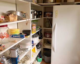 Pantry of kitchen goods, cookware and freezer