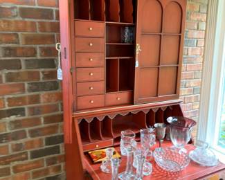 Mahogany secretary desk with crystal glassware