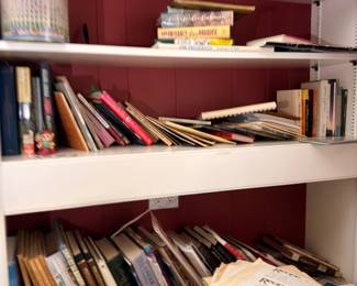 Shelves of books and assorted papers