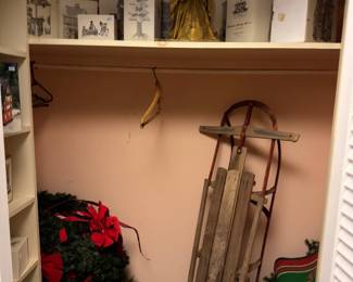 Christmas village houses and vintage wood sled