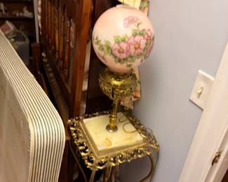 Pink painted parlor lamp on gilt stand