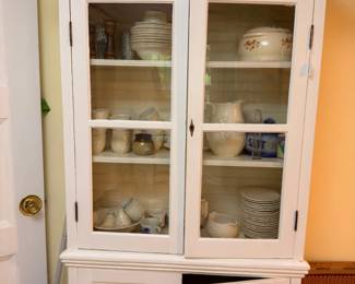White corner china cabinet with dishes