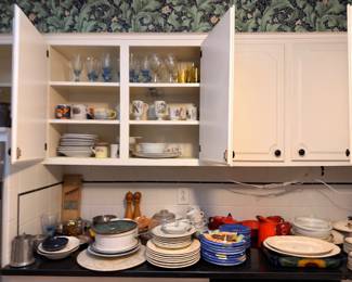 Kitchen cabinets full of dishes and glassware