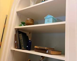 Built-in shelves with assorted decor and collectibles