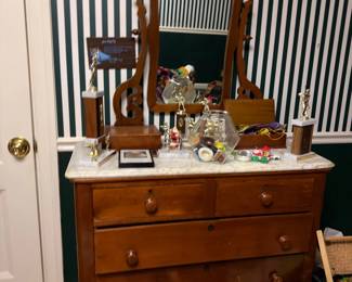 Antique marble-top dresser with swivel mirror