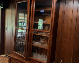 Antique walnut china cabinet with glass doors