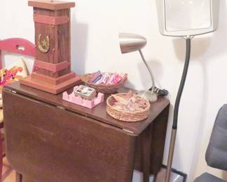 Drop leaf table, magnifying lamp