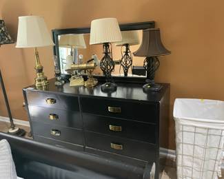 Black chest of drawers, mirror and lamps