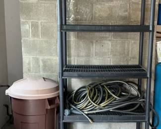 Garage Shelve, Hose, And Trashcan
