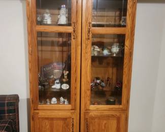 Two Curio Cabinets with bottom storage cabinets (in basement)