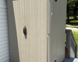 Portable small shed wired with fans for plants