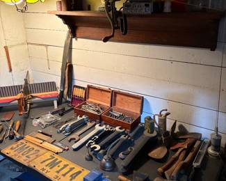 Vintage jars, CB radio with accessories,  full set of open end mechanics wrenches, vintage axes, files, planers, oil cans, vintage license plates and hanging lamp.