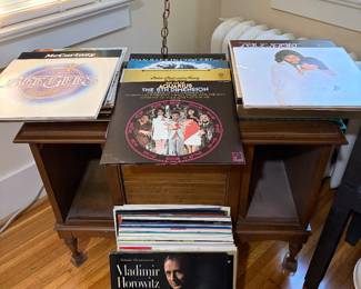 Vintage album storage unit and vinyl albums including Bee Gees, Bonnie Rait, Paul McCartney, Love Story and more.