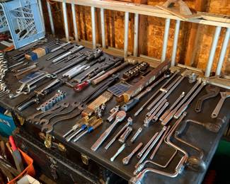 Craftsman Crescent wrenches, open and closed end wrenches, socket sets with Drivers, vintage monkey wrenches, hand drills, chisels, screw drivers and ext ladder.