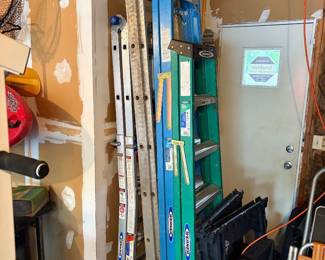 18 ft, 10 ft and adjustable Werner ladder, saw horses and one extension ladder.