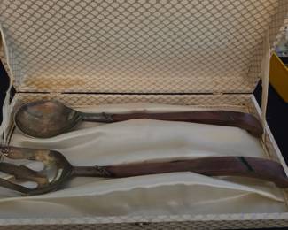 vintage serving set features silver spoon and fork heads paired with distinctive wooden handles