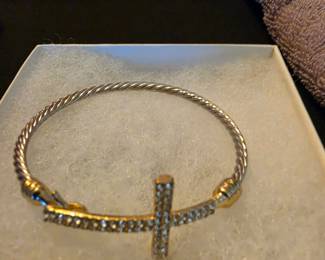 two-tone cable bangle features a pave crystal cross charm