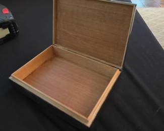 decorative silver & wooden box, often used as a cigarette or cigar box