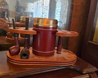  walnut wood base, a glass tobacco jar wrapped in maroon leather