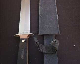 Schrade fixed blade knife with a distinct "SCHRADE" logo embossed on the hilt