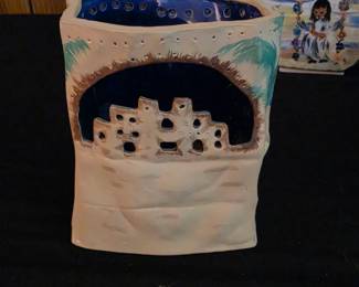 Southwestern-style pottery item is a votive candle holder