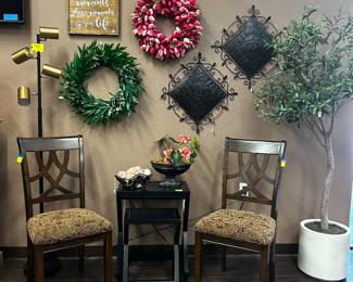 Chairs, faux potted plant, wreaths, decor, side table