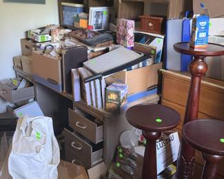 office supplies, desk, chest of drawers, plant stands, end table, lamps