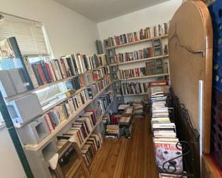 books, dresser with mirror, artwork