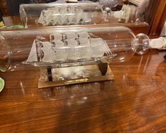 Glass ship in bottles