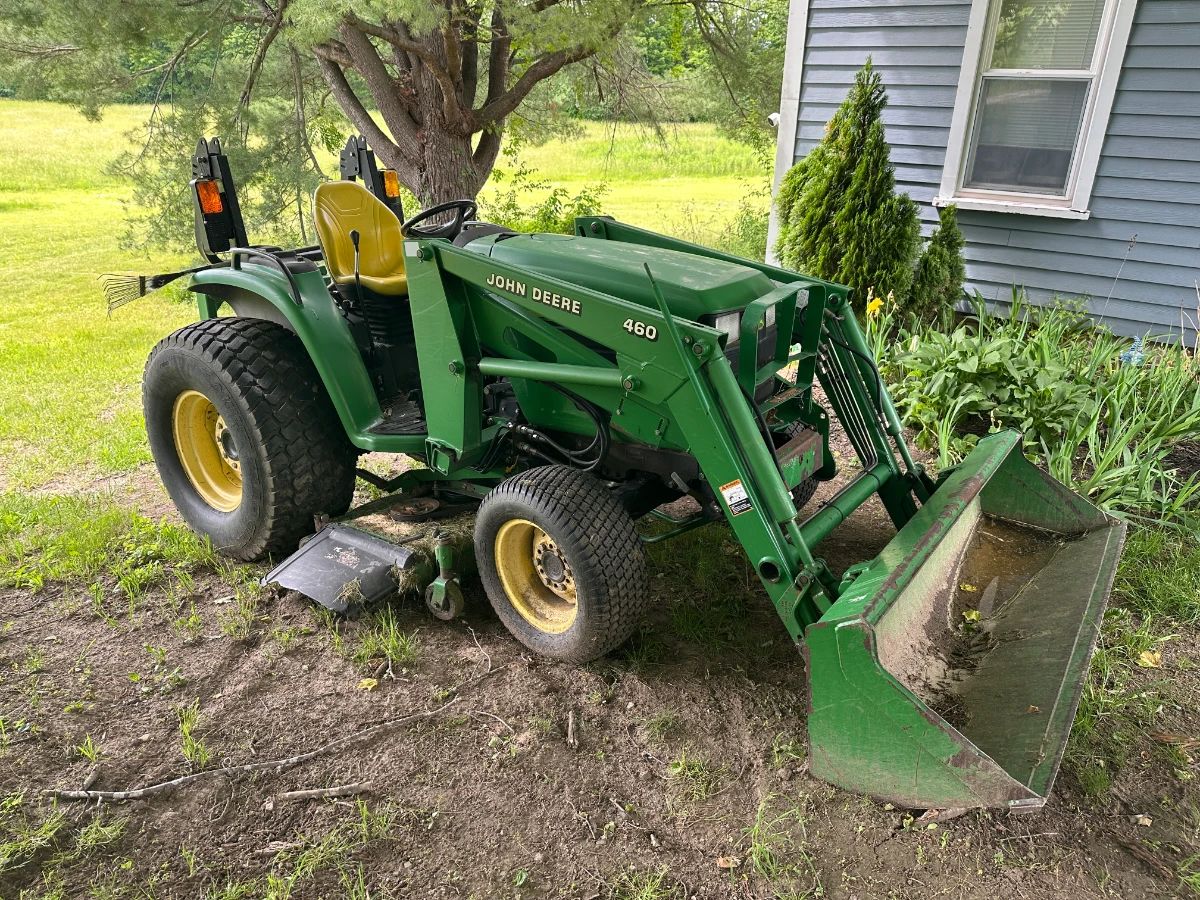 John Deere 4710 Tractor with bucket loader and brush hog