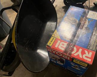 Ryobi saw and a wheelbarrow