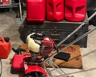 lots of gas cans and a tiller (newer)