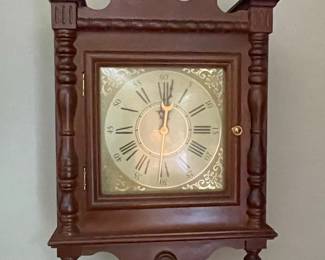 Wooden Wall Clock with Roman Numerals and Decorative Pediment