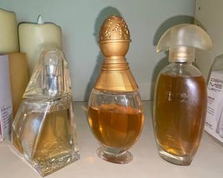 Assorted Women's Perfume Bottles and Dermelect Luminous Nail Coat