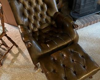 Brown leather Sleepy Hollow chair, and ottoman set. Note: There are a few tears in the leather.