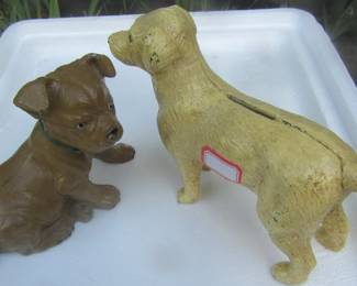 Cast iron small dogs, age is unknown.